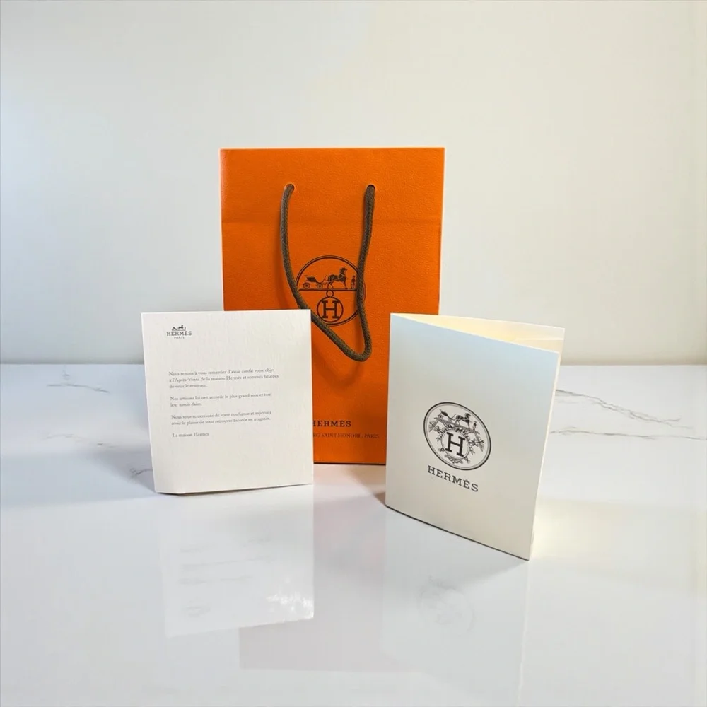 Hermès Vibrant Orange Bag with Elegant Cards